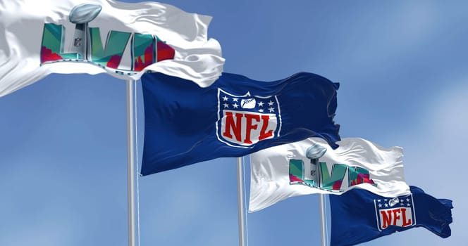 Glendale, US, Nov 2022: Flags of he 57th Super Bowl and NFL waving in the wind. The game is scheduled to be played on February 12, 2023 in Glendale, Arizona