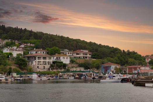 View of the mountains of Kinaliada island from Marmara Sea, with traditional summer houses and boats, Istanbul, Turkey