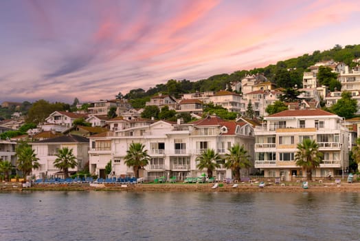 View of the mountains of Kinaliada island from Marmara Sea, with traditional summer houses and boats, Istanbul, Turkey