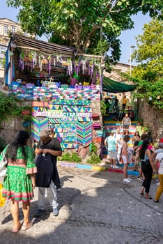 Istanbul, Turkey - August 28 2022: Tourists visiting famous traditional cafe decorated with multicolored panels and colorful stairs, suited in Balat District