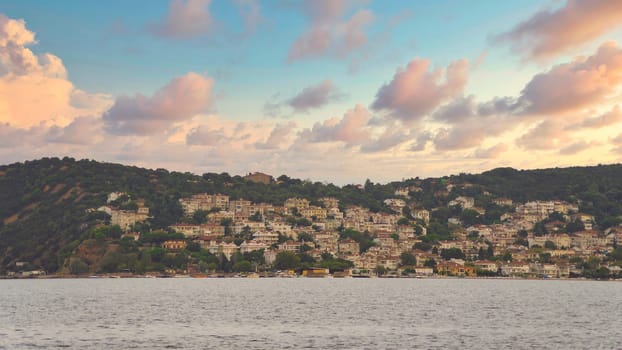 View of the mountains of Kinaliada island from Marmara Sea, with traditional summer houses and boats, Istanbul, Turkey
