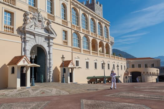 Monte Carlo - August 2022: guard with Summer uniform walking in front of the Royal Palace