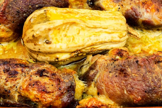 Tasty baked meat roulade stuffed with pumpkin in the oven dish. Autumn recipe.