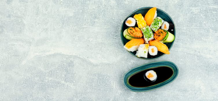 Traditional sushi rolls on the plate. Sushi menu. Japanese food. Space for text