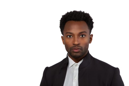 twenty year old man head shot suit style on white background studio portrait serious confident businessman