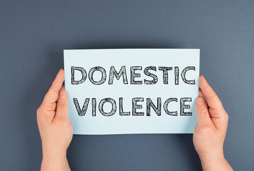 Domestic violence is standing on the paper, international awareness month october for victims and survivors