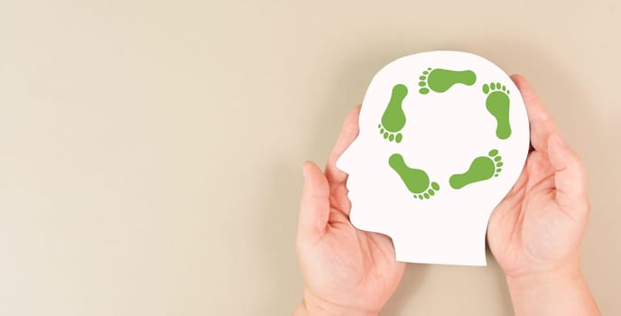 Human head with green co2 footprint, carbon emission, eco friendly lifestyle, climate change and global warming concept