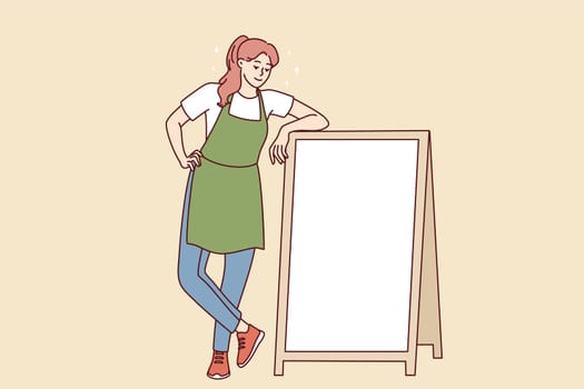 Smiling female waiter in apron standing near mockup cafe advertising board. Happy waitress show good deal on placard. Copy space. Vector illustration.