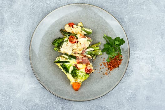 Asparagus wrapped in bacon with grated parmesan cheese.Food background