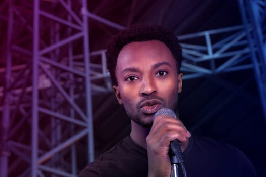 pop singer on stage singing song live show rock star vocal performance karaoke party music event