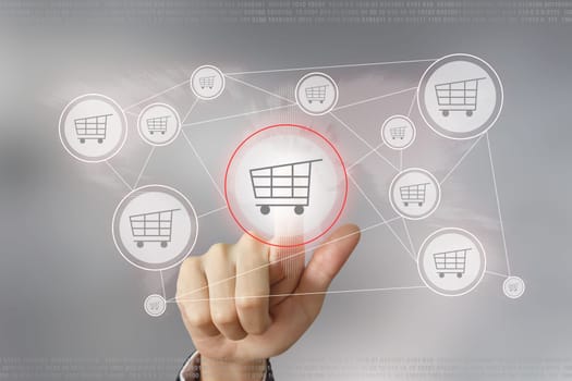 hand pushing e-commerce button with global networking concept