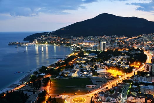 Aerial view of Budva, Montenegro on Adriatic coast after sunset.