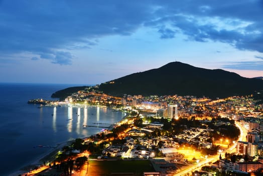 Aerial view of Budva, Montenegro on Adriatic coast after sunset.