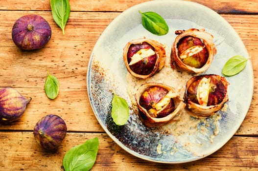 Baked figs with cheese and bacon. Festive autumn snack.