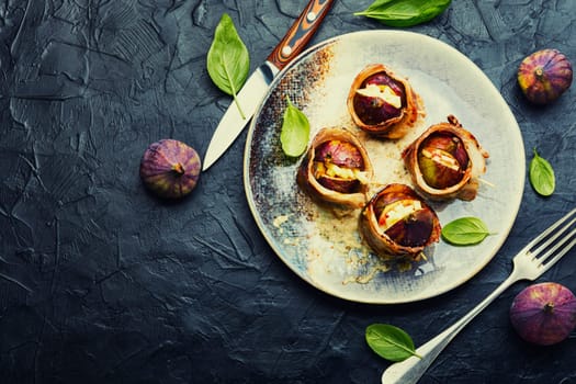 Baked figs with cheese and bacon. Festive autumn snack.