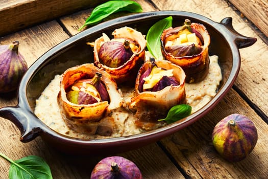 Baked figs with cheese and bacon. Festive autumn snack.