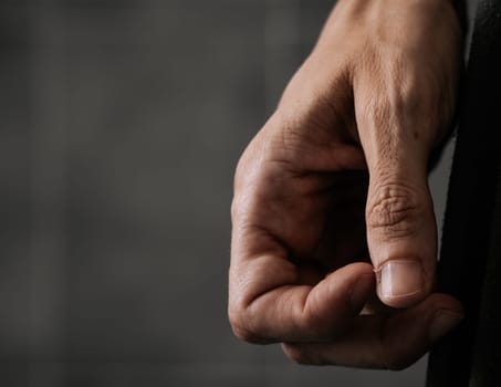 Close up of the hand of a woman who is nervously scratching a hangnail. Agitation concept.