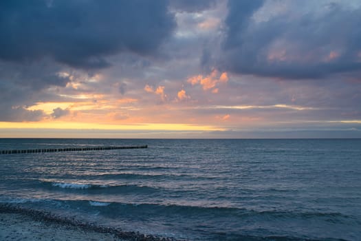 Sunset on the Baltic Sea. Sea, bean strong colors. Vacation on the beach. Romantic mood on the darss. Landscape photo.