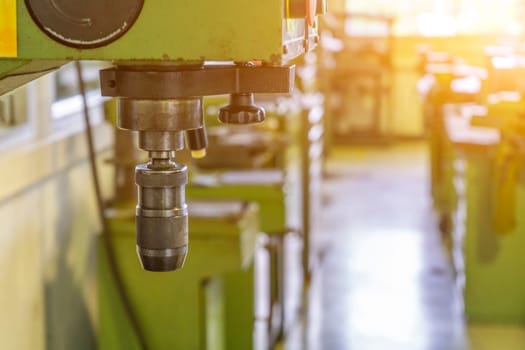 Machine workshop with drilling machine in morning