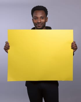 show board man holding blank copy space yellow cardboard empty poster message presentation presenting display