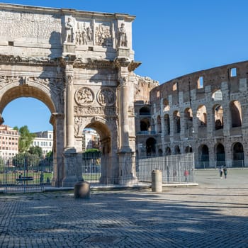 Rome, Italy - October 8, 2020: Colosseum, 1st century antique, oval amphitheatre in the centre of the city, one of New7Wonders of the World and Arch of Constantine, (Arco di Costantino)