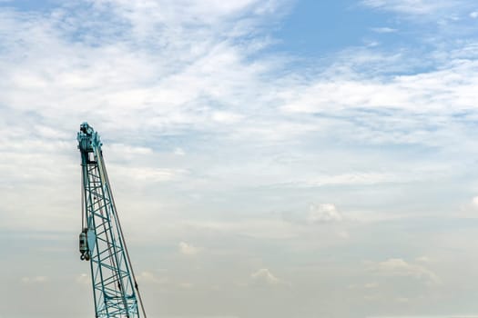 Crane lift of  green on blue sky background