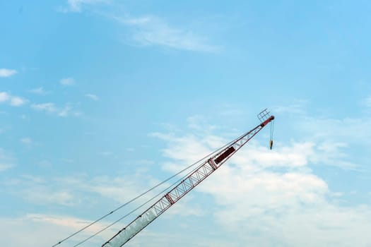 Crane lift of  green on blue sky background