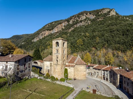 View of the bell tower and the apse of the Romanesque church of Beget, Spain