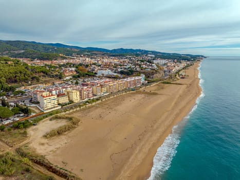 Aerial panoramic view of Canet de Mar city at dawn. Located in El Maresme, Barcelona, Spain