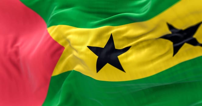 Close-up view of the Sao Tome e Príncipe national flag waving in the wind. Fabric textured background. Selective focus. 3d illustration