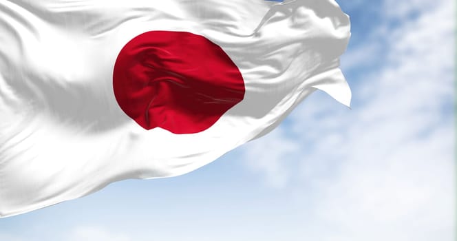 Close-up view of the Japan national flag waving in the wind. Japan is an island country in East Asia. Fabric textured background. Selective focus. 3d illustration