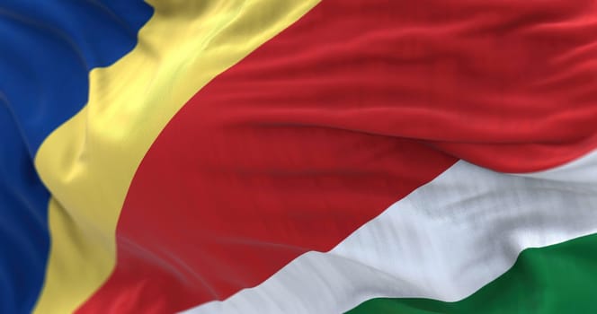 Close-up view of the Seychelles national flag waving in the wind. the Republic of Seychelles is an archipelagic country consisting in the Indian Ocean. Selective focus. 3d illustration