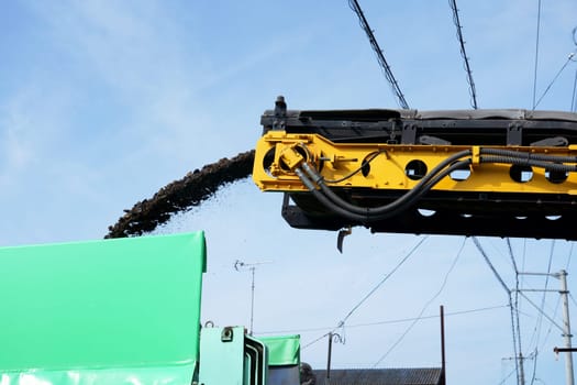 Road cold milling machine removes the old asphalt. Repair of asphalt pavement of the road.