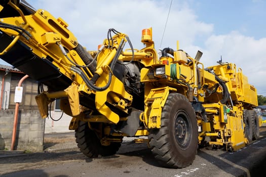 Road cold milling machine removes the old asphalt. Repaving the road surface. Road works