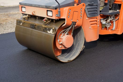 Heavy vibratory road roller close-up. Repaving the road surface. Road works