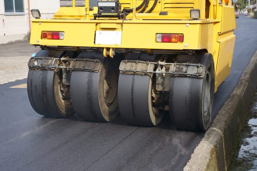 Heavy vibratory road roller close-up. Repaving the road surface. Road works