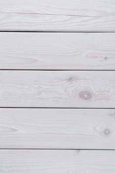 White striped planking. Wooden plank background for design and decoration. Copy space. Place for text. Light hardwood material. Horisontal row of floorboards. Wooden textured, natural tree. Vertical