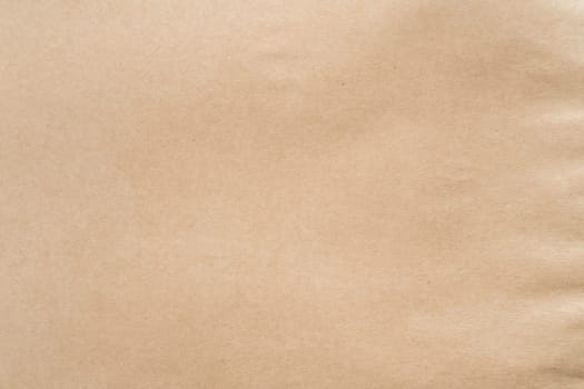 Beige packaging paper. Ecological production, canvas texture, recycling and zero waste technology. Sustainable resource, eco friendly. Degradable material and environment care. Full frame, copy space