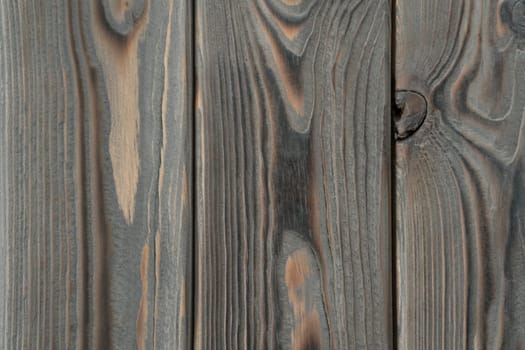 Gray striped planking. Wooden plank wall background for design and decoration. Empty space. Place for text. Dark hardwood material. Vertical floorboards. Wooden textured, natural tree.
