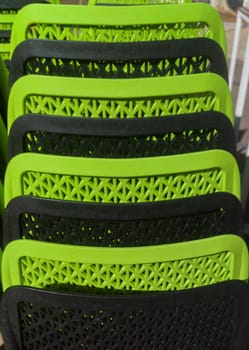 Pilled terrace plastic stools. Black and green color