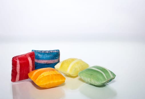 Candy in pillow shape on white background. Delicious sweet tooth.