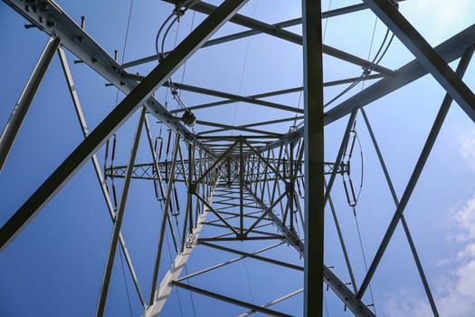 The steel pole from a power pole. Power lines are held by a metal pole.