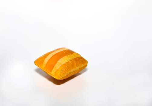 Candy in pillow shape on white background. Delicious sweet tooth.