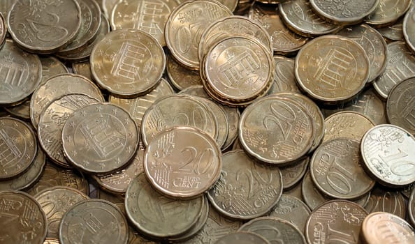 Many coins, euro currency lying in a heap.