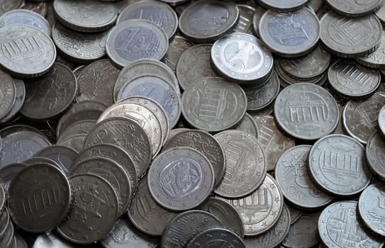 Many coins, euro currency lying in a heap.
