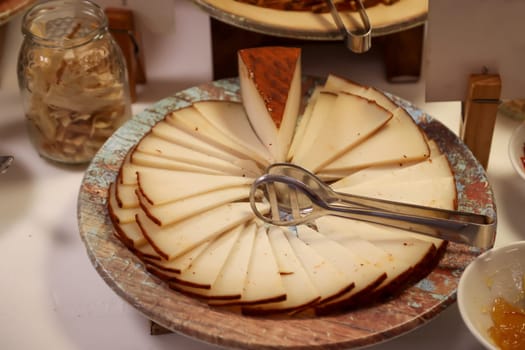 Many slices of cheese cut in the shape of a cake.