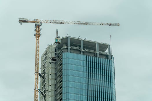 Building site with cranes and blue sky