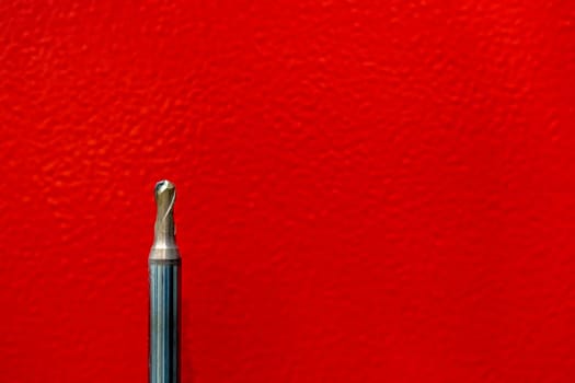 CNC tool ball or endmill ball dilapidated and red background