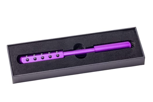 Germanium stone massage roller for face, eyes and body in a black package. It promotes blood circulation and metabolism. Clipping path. Anti-aging, improving and tightening the skin. Beauty concept.