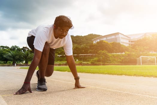 Asian young athlete sport runner black man wear feet shoe active ready to start running training at the outdoor on the treadmill for a step forward, healthy exercise workout, closeup face front